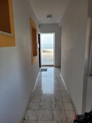 a hallway with a view of the ocean from a house at Sol&mar in Ponta do Sol