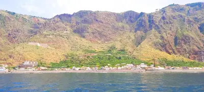 a view of a mountain from the water at Apartamento do Corpo Santo in Funchal