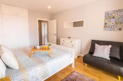 a living room with a couch and a table at Maria Casa Branca by ALMA Holiday Rentals in Funchal
