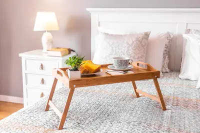 a coffee table in a bedroom with a bed at Maria Casa Branca by ALMA Holiday Rentals in Funchal