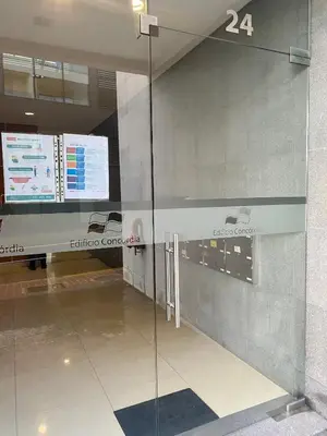 a glass door in a building with a lobby at Concordia Apartment in Funchal