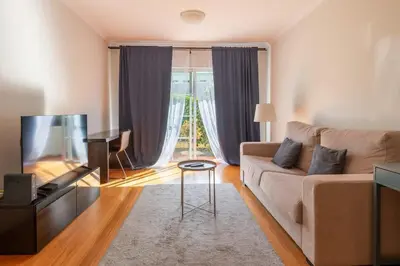 a living room with a couch and a television at Unique Two-Patios - Stylish Stay by Pico Fortress in Funchal