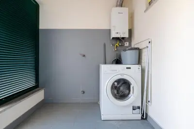 a laundry room with a washing machine in it at Unique Two-Patios - Stylish Stay by Pico Fortress in Funchal