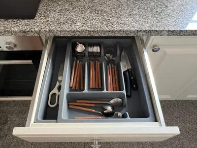 a drawer filled with cooking utensils in a cabinet at Unique Two-Patios - Stylish Stay by Pico Fortress in Funchal