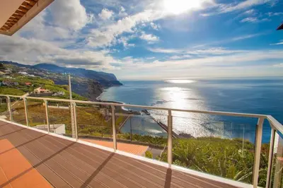 a balcony of a house with a view of the ocean at Benoni House by Stay Madeira Island in Ponta do Sol