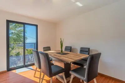 a bedroom with a bed with a checkered floor at Villa Rosa with private pool by Holiday Rental Madeira in Ribeira Brava