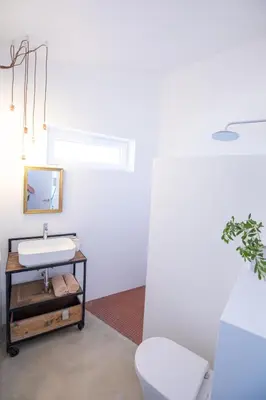 a bathroom with a sink and a toilet at Moinho Calmo in Vila do Bispo