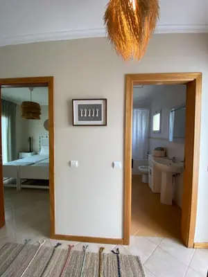 a room with a mirror and a bathroom at Cool Apartment in Porto Santo