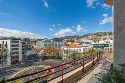 a view of a city from a balcony of a building at The Mountain Apartment by An Island Apart in Funchal