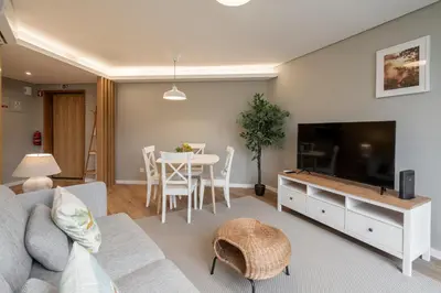 a living room with a couch and a table at The Mountain Apartment by An Island Apart in Funchal