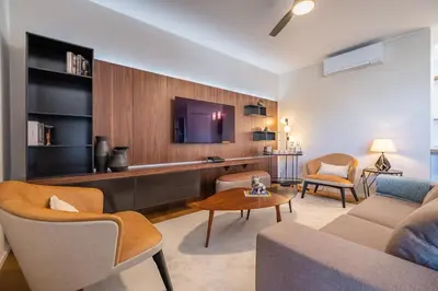 a living room with a couch and a table at Maha by KAAMAH - 2 Bedroom OceanView Designer Apartment in Funchal