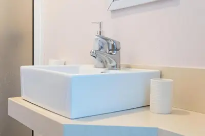 a bathroom sink with a faucet on a counter at Casa Luz - Arco da Calheta in Arco da Calheta