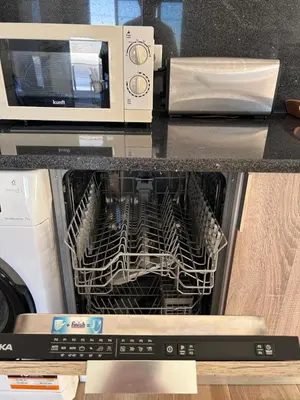 a dishwasher with a drying rack inside of it at Calheta Ocean View Apartment 2 - Air Condition in Estreito da Calheta