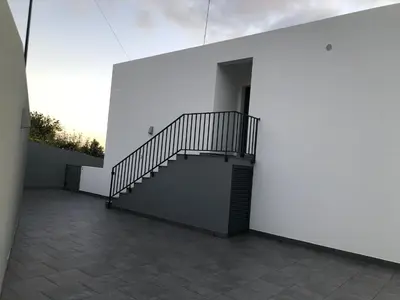 a staircase on the side of a building at Calheta Ocean View Apartment 2 - Air Condition in Estreito da Calheta