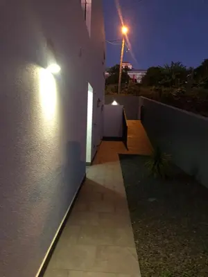 a hallway leading to a house at night at Calheta Ocean View Apartment 2 - Air Condition in Estreito da Calheta