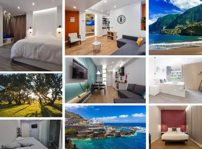 a living room with a couch and a table and a television at The Jolie - Apartments by the Ocean in Porto Moniz