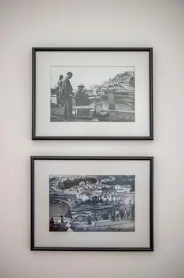 a group of three framed photographs on a wall at Casa do Ilhéu - House of Ilhéu - Câmara de Lobos in Câmara de Lobos