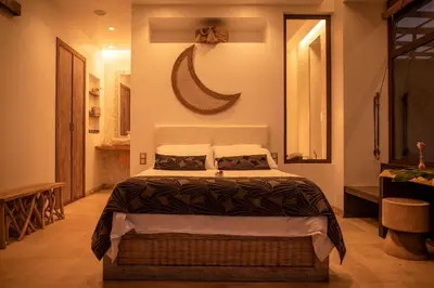 a bedroom with a bed and a mirror and a shower at Villa - Cantinho do Paraíso in Santo Espírito