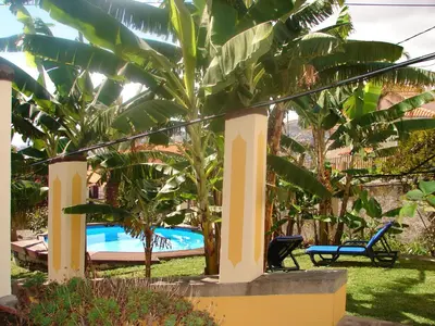 a pool in the middle of a yard with trees at Private Pool Apt. with Great View in Funchal