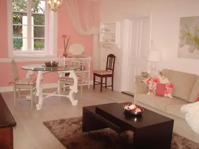 a living room with a table and a couch at Private Pool Apt. with Great View in Funchal