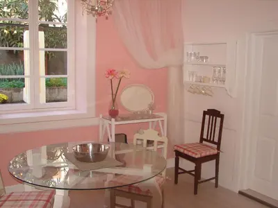 a dining room with a glass table and two chairs at Private Pool Apt. with Great View in Funchal