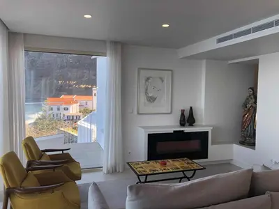 a living room with a couch and chairs and a fireplace at Casa Del Mar- Wonderfull Sea Views & Swimming Pool in Ponta Delgada