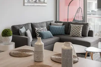 a living room with a couch and a table at Amparo Delight by Homie in Funchal