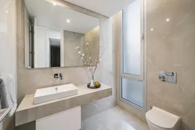 a bathroom with a sink and a mirror and a toilet at OurMadeira - Ocean Panorama in Estreito da Calheta