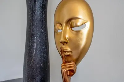 a gold mask hanging on a pole at VILLA LEONARDO in Caniço