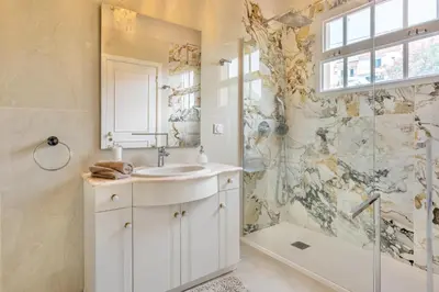 a bathroom with a sink and a shower at VILLA LEONARDO in Caniço