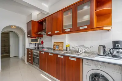 a kitchen with a sink and a dishwasher at Vista Mar - Burgau in Burgau