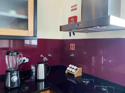 a kitchen with a blender on top of a counter at Brazão Guest House in Santana