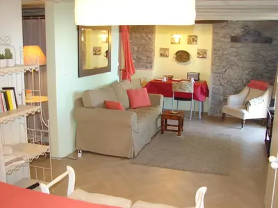 a living room with a couch and a table at Romantic Studio in Funchal