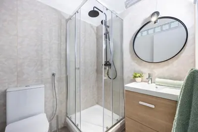 a bathroom with a shower and a toilet and a sink at Fortaleza sea view Villa Miramar - Downstairs Apartment II in Burgau