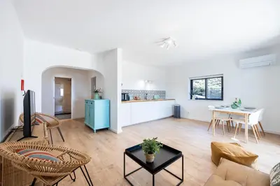 a living room with a couch and a table at Fortaleza sea view Villa Miramar - Downstairs Apartment II in Burgau