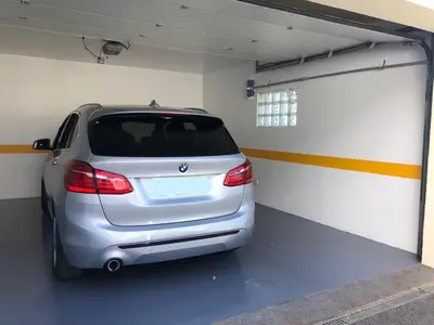 a silver car is parked in a garage at Morning Star Villa in Arco da Calheta