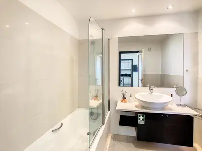 a bathroom with a sink and a shower at Rodamar Apartment by LovelyStay in Funchal