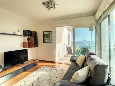 a living room with a couch and a fireplace at Rodamar Apartment by LovelyStay in Funchal