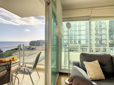 a living room with a view of the ocean at Rodamar Apartment by LovelyStay in Funchal