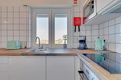 a kitchen with a sink and a counter top at Sea Salt, Sagres Apartment in Sagres