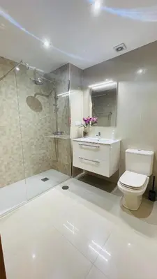 a bathroom with a toilet and a shower and a sink at Anadia Chic Apartment in Funchal