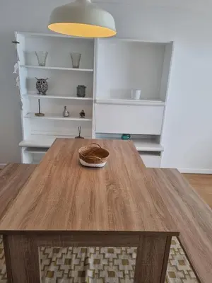 a dining room with a wooden table in a room at Ocean at your feet! in Funchal