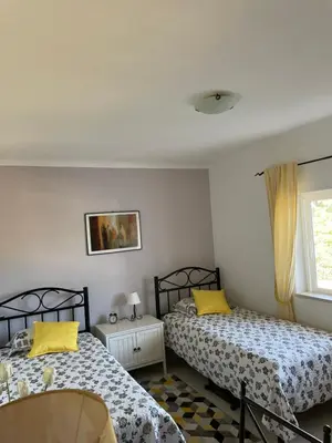 a bedroom with two beds and a window at Superbe appartement vue sur mer à 180° Luz in Luz