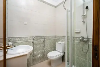 a bathroom with a toilet and a sink and a shower at WOW Flat, Birdie, Golf, Spa & Swimming Pool (WIFI) in Lagos