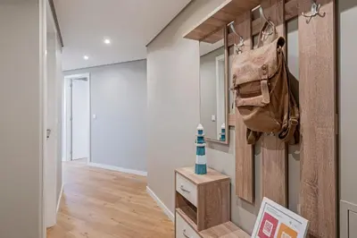 a hallway with a purse hanging on a wall at The Boats Apartment by An Island Apart in Funchal