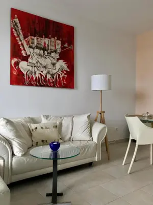a living room with a couch and a table at Vista Dourada in Porto Santo