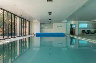 an empty swimming pool in a building at Estrela da Praia da Luz - 2 Bedroom Sea View Apartment in Luz