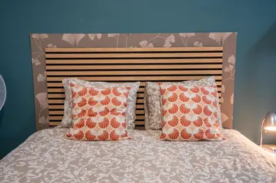 a bedroom with a bed with two towels on it at Madeirarooms in Funchal