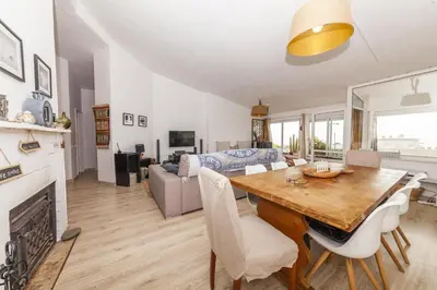 a living room with a table and a couch at C18 - Church Square Apartment in Praia da Luz in Luz