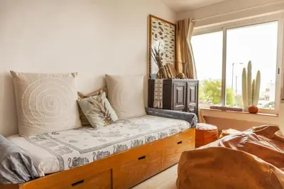 a room with a bed with a window and a couch at C18 - Church Square Apartment in Praia da Luz in Luz